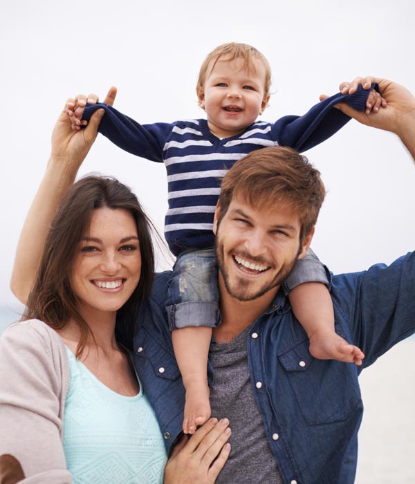 smiling family of 3
